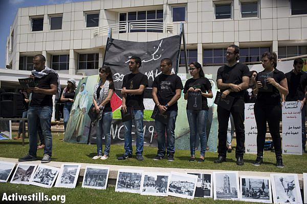 Palestinian students lead a Nakba commemoration ceremony at Tel Aviv University. (photo: Activestills.org)