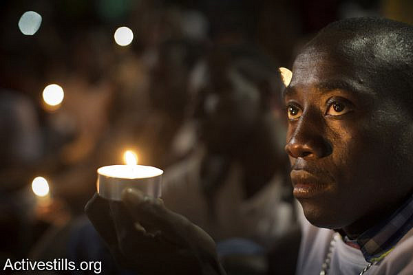 Asylum seekers from Darfur take part in the 11th memorial day for the genocide in Darfur, in Levinsky park, South  Tel Aviv, April 30, 2014.