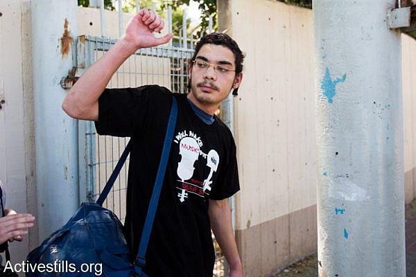 Uriel Ferera, 19-year-old orthodox Jew from Beer Sheva, enters Tel Ha'Shomer Military Base, where he will announce his refusal to draft to Israeli army service, April 27, 2014. Uriel says he refuses to take part in the occupation and that his request for civil service instead of a military one was rejected by the army.