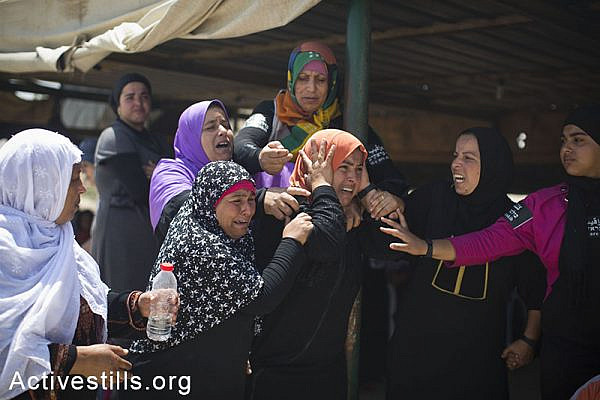 Residents of Beduin village of Al Araqib react as Israeli authorities destroy the village for the 65th time, Negev, June 12, 2014. The Israeli land administration, backed up with large police forces entered the village early morning and destroyed all structures including the mosque. (Oren Ziv/Activestills.org)