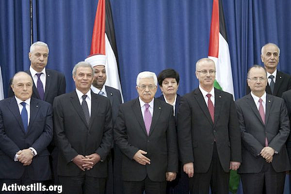 The new Palestinian government, Ramallah, June 2, 2014. (Photo: Mustafa Bader/Activestills.org)