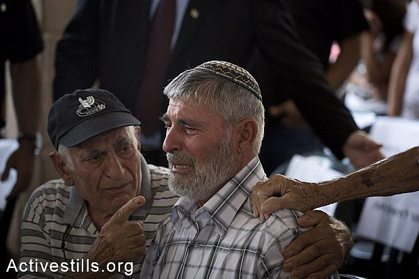Dror Khenin's father mourn hum during the funeral ceremony,  July 16, 2014 in the city of Yahud, Israel. Khenin is the first Israeli to be killed by a rocket since Israel started the recent attack on the Gaza strip, as he offered food to Israeli soldiers near the Erez border crossing between Israel and Gaza. (Oren Ziv/Activestills.org)