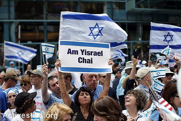 A pro Israeli rally organized by the Israeli consulate in Chicago, IL, on July 22, 2014. At the same time, a protest against the Attack on Gaza was held across the street. (Tess Scheflan/Activestills.org