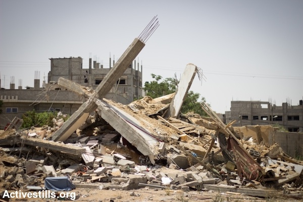 Ruins of the home of Al Haddad family, which was destroyed by an a Israeli drone missile, in Al Shaja'ia neighborhood, Gaza City, July 12, 2014. The family of 25 people evacuated the building before the home was hit. (Photo: Basel Yazouri/Activestills.org)
