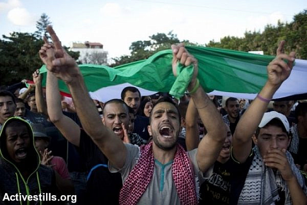Palestnians living in Israel take part in a protest against the attack on Gaza in the city of Lod, Israel, August 3, 2014 (photo: Activestills)