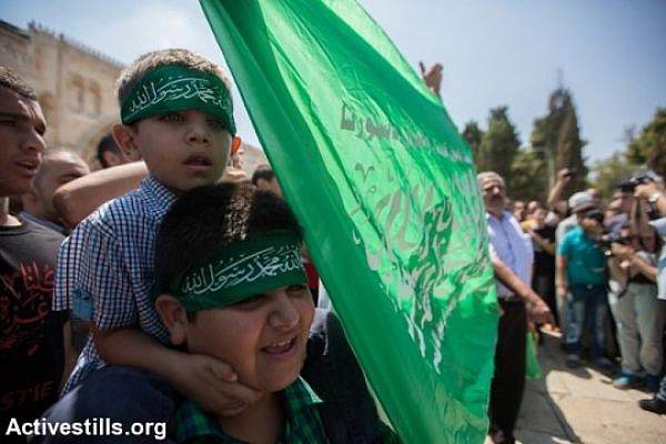 Palestinians gather during a rally supporting the resistance in Gaza following Friday prayers in Al Aqsa Mosque in Jerusalem's Old City, three days after a deal was signed by Israel and Hamas ending a 50-day war, Jerusalem, August 29, 2014. (photo: Activestills)