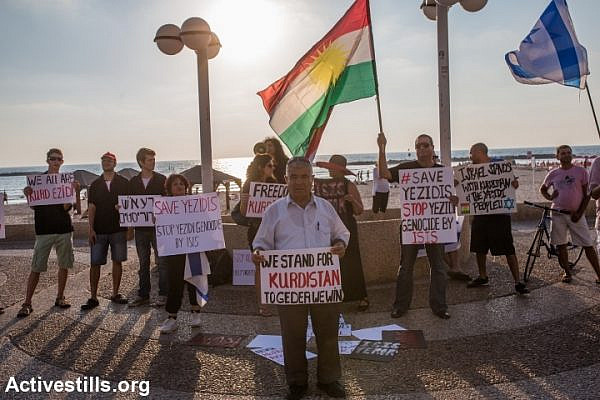 Israelis of Kurdish origin demonstrate in solidarity with the Yazidi community in front of the American Embassy in Tel Aviv, August 13, 2014. The Yazidi community in northern Iraq has recently been attacked by extremists of Islamic State. The protesters called for U.S intervention. (Yotam Ronen/Activestills.org)