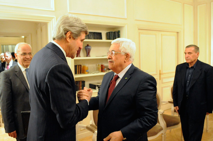 U.S. Secretary of State John Kerry and Palestinian Authority President Mahmoud Abbas shake hands before a meeting in Paris, France, on February 19, 2014. (State Department photo)