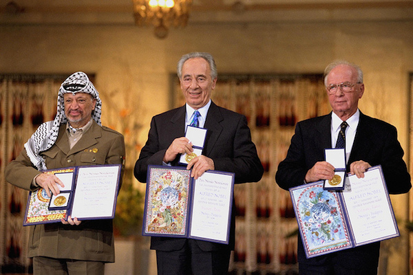 The Nobel Peace Prize laureates for 1994 in Oslo. (From right to left) Prime Minister Yitzhak Rabin, Foreign Minister Shimon Peres and PLO Chairman Yasser Arafat. October 12, 1994. (Photo by GPO/Ya’acov Sa’ar)