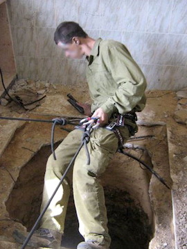 An IDF photo dated April 8, 2001, shows a soldier entering a tunnel shaft that was discovered a few hundred meters from the border fence in the northern Gaza Strip. (Photo by IDF Spokesperson)