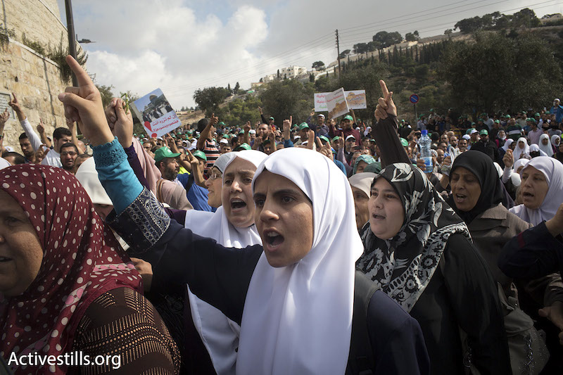 A group of Palestinian women were allowed to enter and pray in the Aqsa Mosque after a Jewish tour group left the site, October 15, 2014. (Photo by Oren Ziv/Activestills.org)