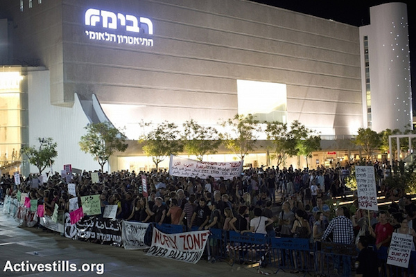 Left-wing activists take part in a protest against the war on Gaza, in central Tel Aviv, July 19, 2014. Right-wing activists tried to attack the leftists during the protest; police arrested at least five right-wing protesters. (Photo by Activestills.org)