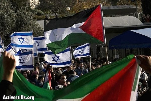 Palestinian and Israeil flags (Activestills)