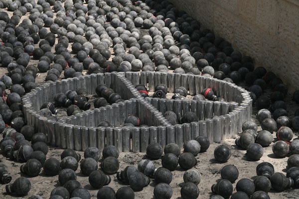 A display of spent tear gas canisters for which Abu Rahmah was indicted but not convicted. (Photo by Oren Ziv/Activestills.org)