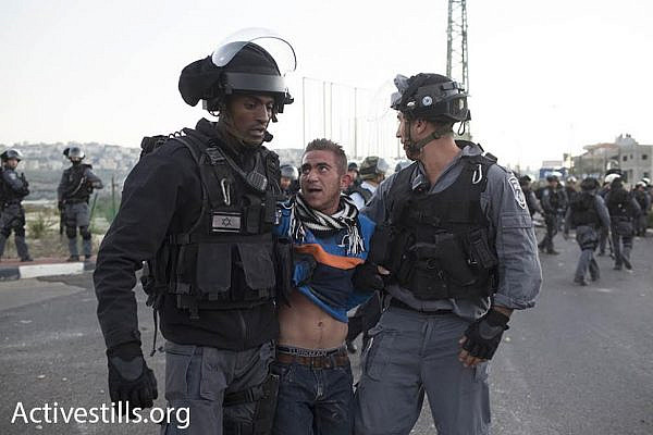 Police arrest a young protester during clashes in Kafr Kanna. (photo: Oren Ziv/Activestills.org)