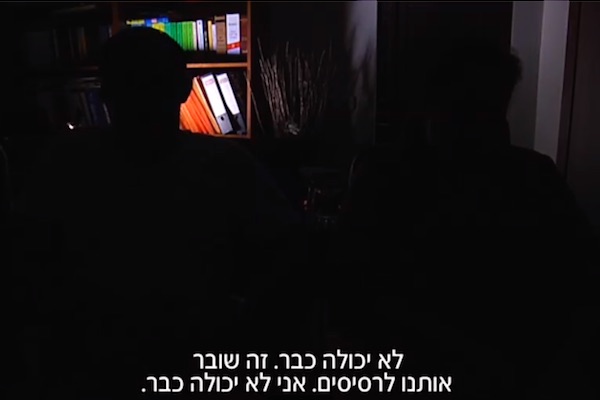 The parents of a border policeman accused of murdering a Palestinian teen at a demonstration in Beitunia speak to Channel 2 News. The caption reads: ‘I can’t take it anymore. It’s tearing us to pieces. I can’t take it anymore.’ (Screenshot from Channel 2 News)