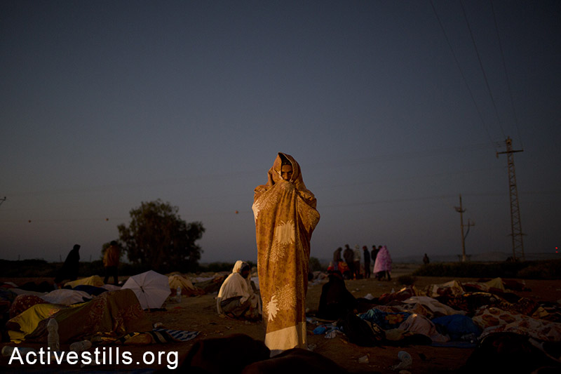 African asylum seekers wake up in the early morning of a second day of protests outside the Holot detention center, Negev desert, February 18, 2014. The protesters were calling to close the prison and to recognize the refugee rights of the African asylum seekers living in Israel. Tali Mayer/Activestills.org