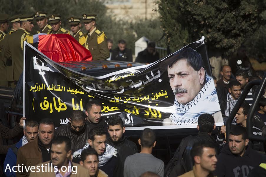 Thousands march from Ramallah to the Al-Bireh cemetery during Ziad Abu Ein's funeral procession, December 11, 2014. (photo: Oren Ziv/Activestills.org)
