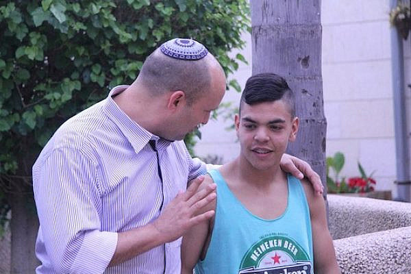 Naftali Bennett speaks to a young Israeli. (photo: Naftali Bennett's official Facebook page)