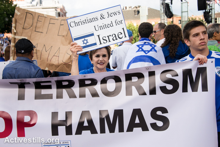A Zionist Christian attends a "Stand with Israel" rally in Boston, MA, August 7, 2014. The rally came in the midst of an Israeli military offensive called Operation Protective Edge that killed at least 2,200 Palestinians, including at least 1,483 civilians. At the same time, 6 civilians in Israel and 66 soldiers were killed by Palestinian militants. (photo: Ryan Rodrick Beiler/Activestills.org)
