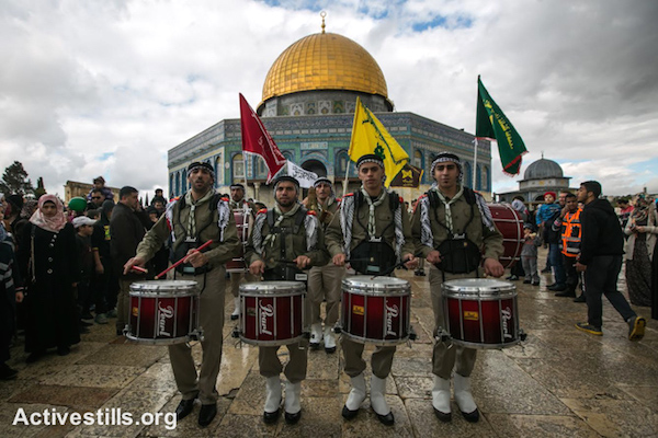 Palestinian scouts march and play music during a ceremony commemorating the birth of Prophet Mohammed, a holiday known in Arabic as Mawlid al-Nabawi, next to the Dome of the Rock in Al Aqsa compound in Jerusalem’s Old City, January 3, 2015. (photo: Activestills.org)