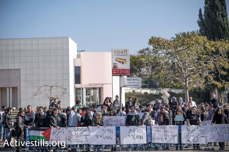 Palestinian citizens of Israel demonstrate at the entrance of Tel Aviv University against Israeli police violence toward Arab citizens, January 20, 2015. (Photo by Activestills.org)