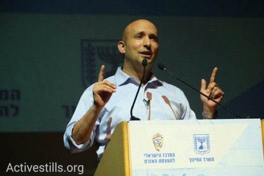 Naftali Bennett speaks at an event for high schoolers voting for the first time, Tel Aviv University, February 8, 2015. (photo: Yotam Ronen)