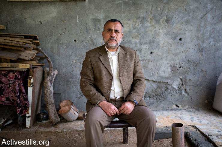 Issam Joudeh sits where an Israeli attack killed four of his children and his wife in the Tel Al-Za'tar neighborhood of Jabaliya, Gaza Strip, March 19, 2015. Israeli forces attacked the yard of the family's home without any warning on August 24, 2014. Three children survived, one of them Thae'er had his leg amputated and is still in Germany where he is receiving medical treatment.