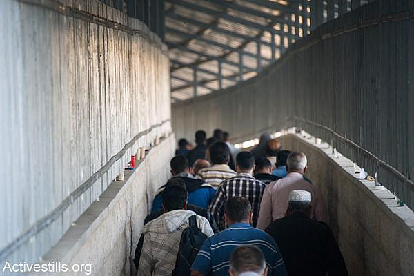 Palestinians enter the main checkpoint separating Bethlehem and Jerusalem. (Activestills.org)