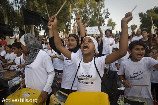 Protesters march on the main street in Ramle, demonstrating against home demolitions in the unrecognized village Dahamash, July 7, 2010. (photo: Activestills.org)