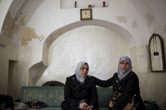 Women from the Sub Lahan family sit in their family home, Old City of Jerusalem. (photo: Tali Mayer/Activestills.org)