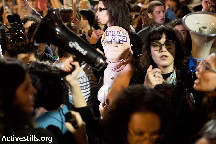 Protesters during a demonstration against rape culture, Tel Aviv, March 29, 2014. Hundreds protested violence against women in response to several sexual violence cases published last week. One of the cases was a complaint filled against MK Silvan Shalom by a former worker.