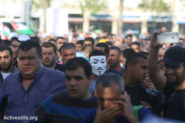 Palestinian citizens of Israel demonstrate against the government's housing discrimination and policy of home demolitions, Rabin Square, Tel Aviv, April 28, 2015. (Oren Ziv/Activestills.org)