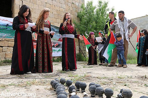 Palestinian children sing during a demonstration marking Land Day in Nabi Saleh village, West Bank, March 28, 2015. Land Day is held every year to mark the deaths of six Palestinians protesters at the hands of Israeli police and troops during mass demonstrations on March 30, 1976, against plans to confiscate Arab land in Galilee. (photo: Activestills.org)
