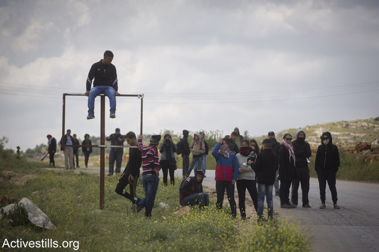 Palestinian youth are seen during the weekly protest against the occupation in the West Bank village of Nabi Saleh, April 10, 2015.