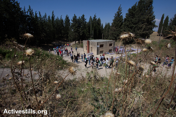 Palestinians take part in an event to commemorate the Nakba in the destroyed village of Lajjun in northern Israel, May 15, 2015.  Nakba, (literally, “catastrophe”) is the Arabic term given to the forced displacement of some 750,000 Palestinian refugees from 500 communities by Zionist forces before, during and after the 1948 War.