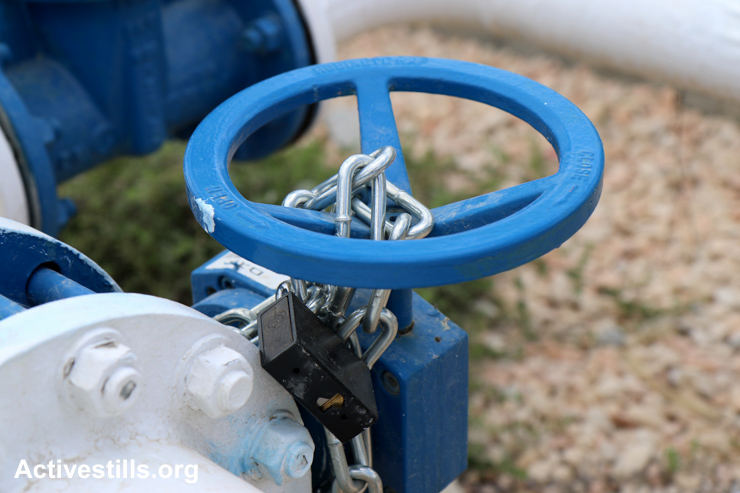 The main water valve of Qarawat Bani Hassan village, near Salfit, is seen locked by Israeli authorities to limit the water supply to area villages, West Bank, May 23, 2015. According to the municipal council of Qarawat Bani Hassan, the portion for each villager has decreased to two liters per day as the village receives only 97 cubic meters per hour. The municipal council said the Israeli authorities did not provide a reason for the situation.