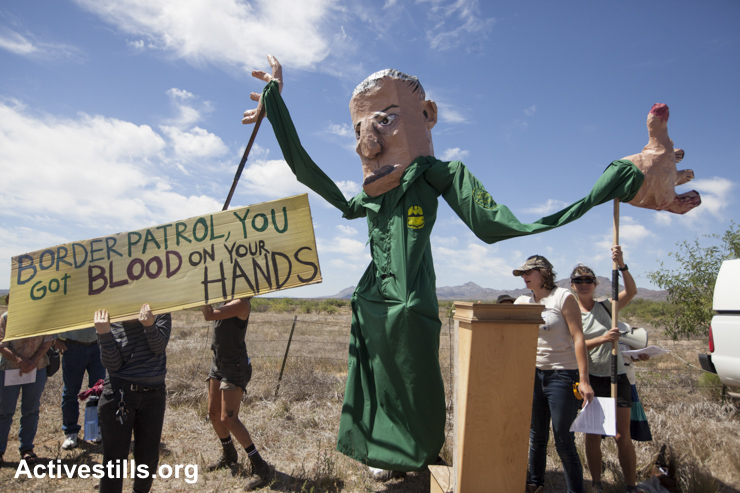 Activists with giant puppets preform political theater during a protest at the Amada checkpoint, Arizona, as part of a day of action against the militarization of the borderlands in Arizona, May 27, 2015.