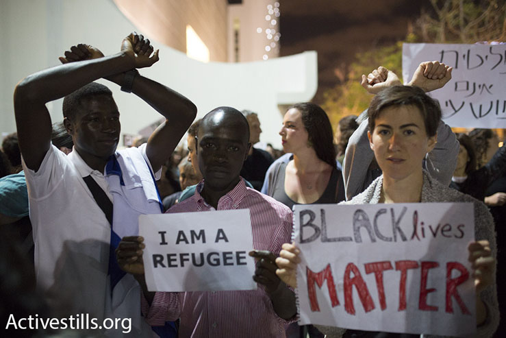 Asylum seekers and Israeli activists protest a proposed policy of giving African asylum seekers in Israel the option of indefinite imprisonment or ‘self-deportation’ to a third country, Tel Aviv, May 2, 2015. (Photo by Oren Ziv/Activestills.org)