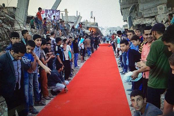 Attendees line the red carpet at the Karama Gaza Film Festival in the Shujaiyeh neighborhood of Gaza City, May 13, 2015. (Photo by Dan Cohen)