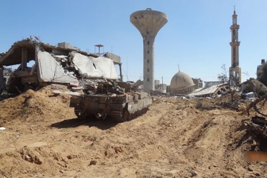 An Israeli tank amid the rubble of a destroyed mosque in the Gaza Strip during 2014’s Operation Protective Edge. (Courtesy of Breaking the Silence)
