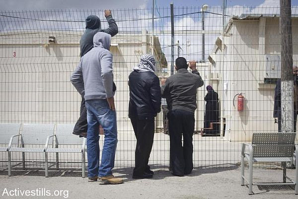The family of Bassem Tamimi's gathers outside the Ofer Israeli Military Court, West Bank, April 10, 2011. (photo: Oren Ziv/Activestills.org)