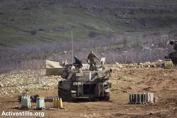 Israeli tanks are positioned along the Syrian border in the occupied Golan Heights, January 29, 2015. (Photo by Oren Ziv/Activestills.org)