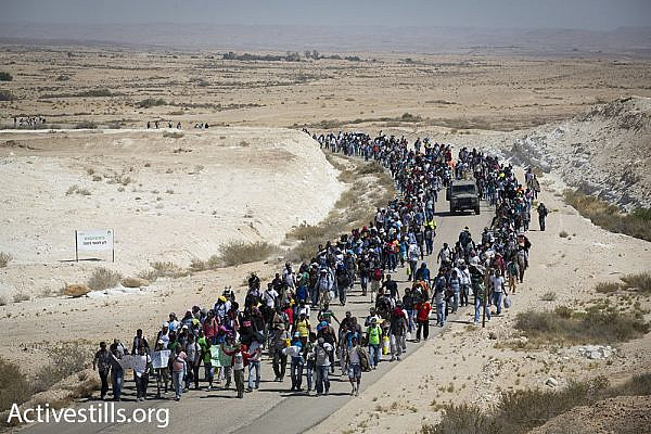 African asylum seekers march from the Holot detention facility toward the Egyptian border.