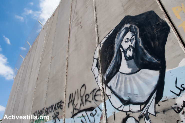 A mural portraying Jesus is painted on the Israeli separation wall dividing the West Bank town of Bethlehem, July 28, 2010. (photo: Ryan Rodrick Beiler/Activestills.org)
