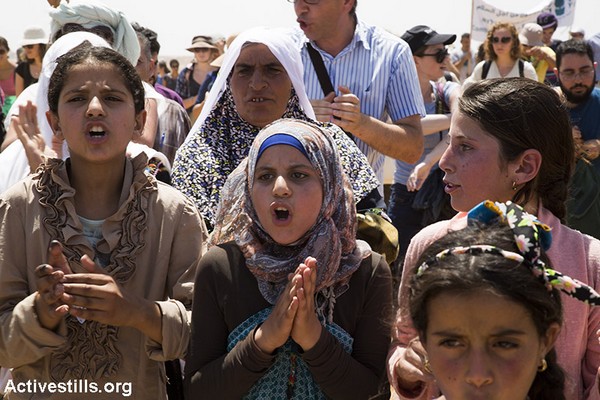 Palestinian girls chant slogans at the protest against the demolition of their village, Susya, July 24, 2015. (Keren Manor/Activestills.org)