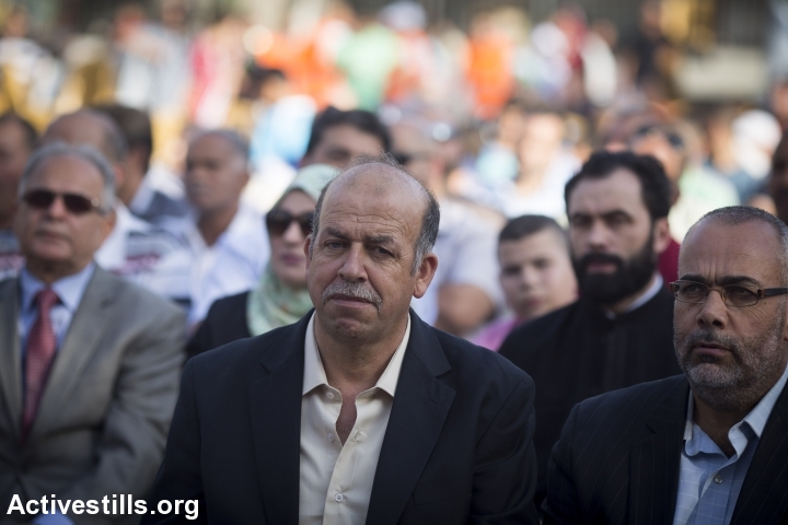Hussein Abu Khdeir sits during a memorial ceremony in honor of his son, Muhammad, who was kidnapped and burned alive by three Jewish men a year ago, Shuafat, East Jerusalem, June 2, 2015. (photo: Oren Ziv/Activestills.org)