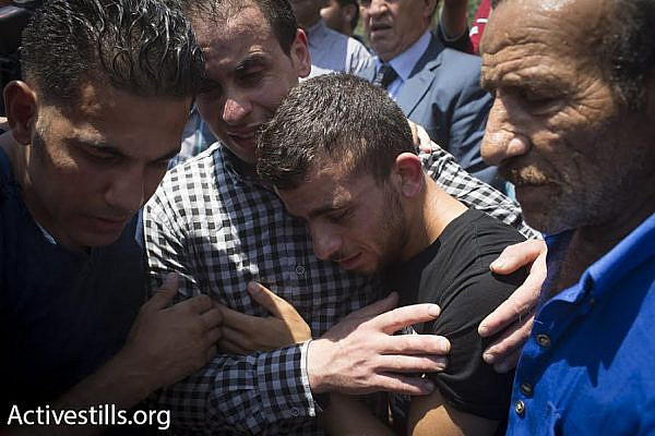 Palestinians mourn during the funeral march for Palestinian baby Ali Saad Dawabshe, Duma, West Bank, July 31, 2015. (photo: Oren Ziv/Activestills.org)