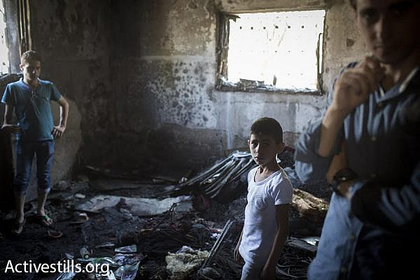 Palestinians from the village Duma gather at the Dawabshe house, which was attacked by two arsonists Friday morning. Ali , an 18-month-old toddler, was burned to death in the attack. His parents and four-year-old brother are currently hospitalized in Israel in serious condition. (photo: Oren Ziv/Activestills.org)