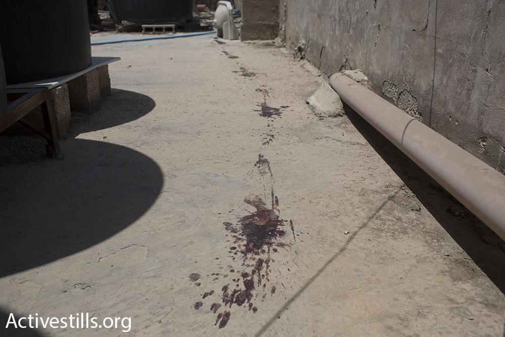 Blood stains on the roof where Muhammad Abu Latifa was shot and killed by Israeli forces, Qalandiya Refugee Camp, July 27, 2015. (Oren Ziv/Activestills.org)